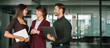 © Stock 4 You - Mature female mentor leader woman collaborating with young team doing banking talking in office. Teamwork of professional business people working discussing financial strategy. Web banner, copy space