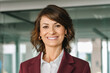 © Stock 4 You - European confident mature middle aged leader female businesswoman manager standing in office. Closeup headshot portrait 40s latin hispanic senior business mentor coach woman leader smiling at camera