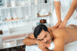 © InfiniteFlow - Caucasian man customer enjoying relaxing anti-stress spa massage and pampering with beauty skin recreation leisure in day light ambient salon spa at luxury resort or hotel. Quiescent