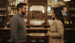 © ArtFocus Studio - A young couple sharing a romantic moment and smiling at each other while standing in a cozy, dimly lit bar with a background of liquor bottles.