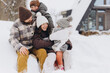 © anatoliycherkas - Happy family enjoying winter vacation in snowy landscape
