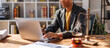 © David - A woman in afro hair paralegal immersed in work at a law office, surrounded by paperwork and legal documents.