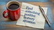 © Mudassir - Motivational napkin message encouraging positivity next to a red coffee mug and a sleek silver pen suggest deep reflection.