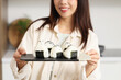 © Pixel-Shot - Young woman with traditional Japanese onigiri in kitchen, closeup
