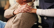 © OnPoint/peopleimages.com - Senior man, wheelchair and holding hands with nurse for assisted living in retirement home. Caregiver, volunteer or helping elderly male person with a disability for healthcare or support in house