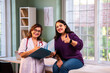 © StockImageFactory - Experienced Indian woman doctor consulting young beautiful patient with case file