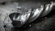 © Graphicfresh - Metallic drill bit wet closeup, industrial tool macro with water drops, sharp edges and textured surface, symbolizing precision, strength, and craftsmanship.