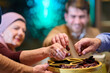 © .shock - Muslim family enjoying iftar together in a restaurant with Ramadan decorations
