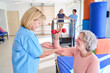 © Robert Kneschke - Senior Woman Lifting Dumbbell With Physiotherapist Assistance During Rehabilitation Exercise Indoors At Rehab Center For Recovery And Strength