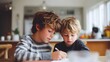 © pkproject - Two young brothers collaborate on their schoolwork at a wooden table in a sunlit room one writing while the other observes capturing a moment of childhood learning and familial connection