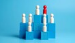 © Usman - Red leader peg figure standing on a tall blue block above white team figures on a vibrant blue background