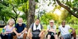 © Rawpixel.com - Group of diverse happy senior friends sit outdoors park. Diverse senior friends enjoy nature after park healthy exercise. Happy and healthy seniors, active outdoors lifestyle, diverse senior group
