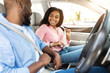 © Prostock-studio - Safety First. Smiling African American Couple Fastening Seatbelts Before Driving In City, Sitting Inside New Luxury Car, Following Safe Ride Rules, Ready For Travel With Auto, Looking At Each Other