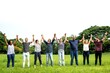 © Rawpixel.com - Diverse group of people holding hands in a field, celebrating unity and diversity. Men and women of various ethnicities, standing together in harmony. Diverse people in a green park, outdoor activity.