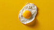© Svetlana - Minimalistic concept of a floating fried egg on bright yellow background