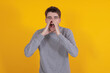 © carballo - isolated young man shouting excitedly