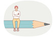 © Valery - Man designer sits on giant pencil and crosses arms in front of chest, demonstrating confidence