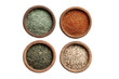 © Sawyer0 - Set of four round spice bowls arranged in a tidy grid, each filled with different dried herbs and seasonings showing distinct colors, flakes, and granular textures isolated on transparent background.