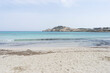 © Outsiderzone - Sandy beach with clear turquoise water and distant hills.. Palma de Mallorca, Spain