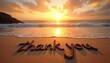 © miss irine - Words thank you written in wet sand on beach at golden hour. Gentle waves approach shoreline reflecting warm sunset light. Peaceful natural seaside scene.