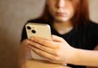 © Elena K - Young teenager pretty girl with smartphone in her hands