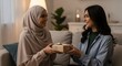 © YNG - Happy Muslim Women Exchange Gifts During Festive Occasion