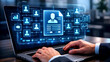 © Sumi Sp - 'A businessman uses a CRM database to manage customer profiles and behavior on his laptop.'