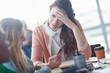 © Laflor2000/peopleimages.com - Stress, woman and students with phone in class for bad news, test results and failed course. Sad, person and friends with mobile for scholarship rejection, assessment mistake and message notification
