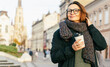 © olezzo - Smiling Middle Aged Woman with Coffee to Go Outdoors