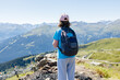 © Elena Medoks - Female hiker admiring breathtaking mountain view in the alps