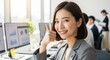 © Stingray_Japan - オフィスでサムズアップする笑顔の20代日本人女性社員