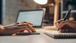 © adoobe - Mentoring session showing hands analyze data write notes at desk during learning under lamp