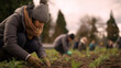 © Kateryna - Faceless community members engage gardening activities local urban farm sunny afternoon late spring winter season shared cultivation neighborhood farming
