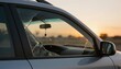 © NAD SANG PAP - Car accident in sunlight captured at dusk urban environment close-up perspective highlighting shattered glass