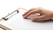 © MS Meraj - Hand reaching towards a clipboard with lined paper on transparent background