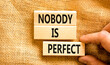 © Dzmitry - Nobody is perfect symbol. Concept words Nobody is perfect on beautiful wooden block. Beautiful canvas background. Business motivational lifestyle and nobody is perfect concept. Copy space.