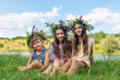 © yanadjan - Child wearing a flower crown outdoors. Selective focus.