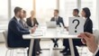 © Artfinity - Business meeting with question mark sign for uncertainty. Corporate problem solving and strategy. Hand holding paper with question mark in front of blurred team in office boardroom