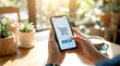© ic - Hands holding smartphone with online shopping cart on screen