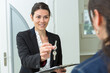 © auremar - female estate agent passing keys to client