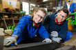 © auremar - happy man and woman in factory