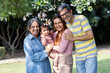 © Photographielove - Happy multigenerational family with baby enjoying time together in park