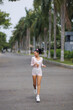 © Buyanskyy Production - Fit Young Woman Jogging Outdoors In Stylish Activewear On Tropical Path