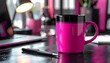 © Fomo Creative - Vibrant Pink Mug on Glossy Black Desk with Laptop and Office Supplies