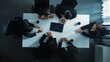 © InfiniteFlow - Top down aerial view of group of business people looking at financial chart while analyze and explain growing stock market statistic. Team placed tablet with chart at meeting table. Directorate.
