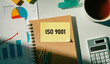 © hogehoge511 - There is sticky note with the word ISO 9001. It is as an eye-catching image.