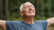 © Ruzana - Elderly man practicing breathing exercises for healthy lung month in nature
