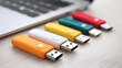 © Sergey - Colorful usb flash drives for portable data storage technology on desk