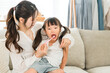 © buritora - Parents and children brushing their teeth with their daughter in the living room, mother and child, family, mother