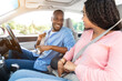 © Prostock-studio - Safety First. Smiling African American Guy And Lady Fastening Seatbelts Before Driving In City, Sitting Inside New Luxury Car, Following Safe Ride Rules, Ready For Road Trip, Looking At Each Other